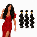 Three bundles of body wave 100% human hair extensions on white background