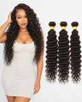 Model posing beside three bundles of deep wave human hair extensions on white background